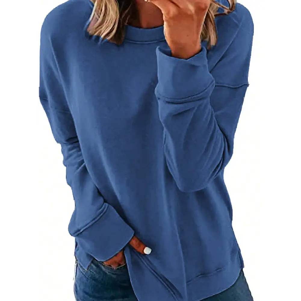 A heathered blue long sleeved womens sweatshirt with a relaxed fit and ribbed cuffs perfect for fall fashion