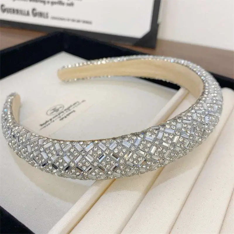 A sparkling silver heavy industry light luxury pearl style headband with geometric baguette and round crystals