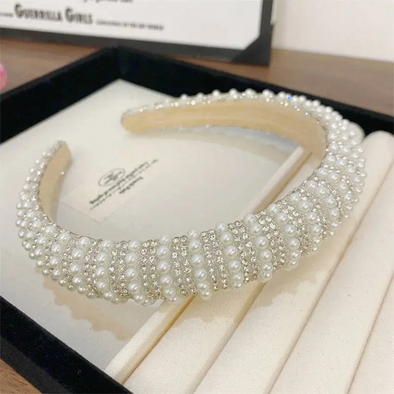 Heavy industry light luxury pearl style headband featuring white pearls and sparkling silver rhinestones on a wide band