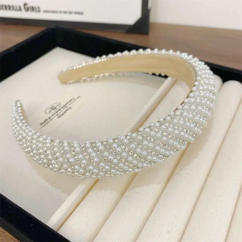 Heavy industry light luxury pearl style headband with sparkling silver rhinestones and a soft beige interior