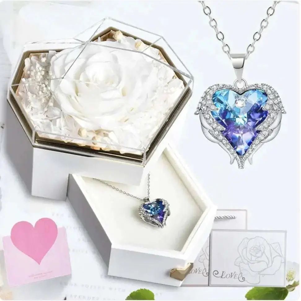 Heart-shaped pendant necklace with blue and purple crystal and clear stones in a silver hexagonal rose jewelry gift box