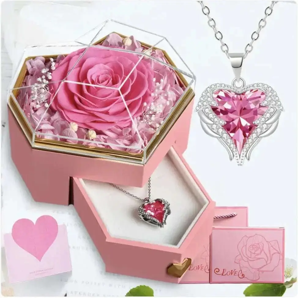 Pink preserved rose in a clear hexagonal glass top jewelry gift box inside a pink rose jewelry gift box
