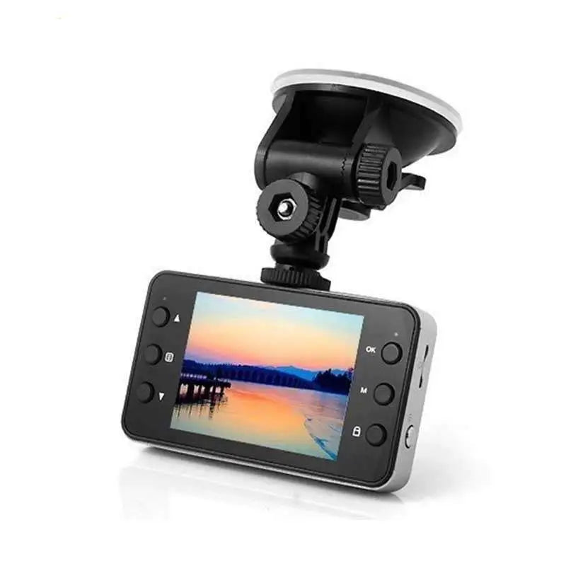 Black and silver hidden type dash cam with 3.0 inch screen and suction cup mount displaying sunset over water