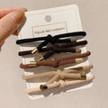 Set of five high elasticity braided wrist hair ties in black brown beige and cream with gold-toned metal ends for secure hair styling