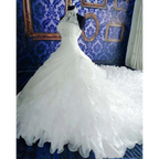 White high-necked wedding dress wholesale with intricate lace and voluminous ruffled big tail skirt design