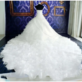 Voluminous white wedding dress wholesale with fitted bodice and ruffled big tail layered skirt for elegant occasions