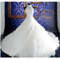 White floor-length wedding dress wholesale with fitted lace bodice and voluminous ruffled big tail skirt