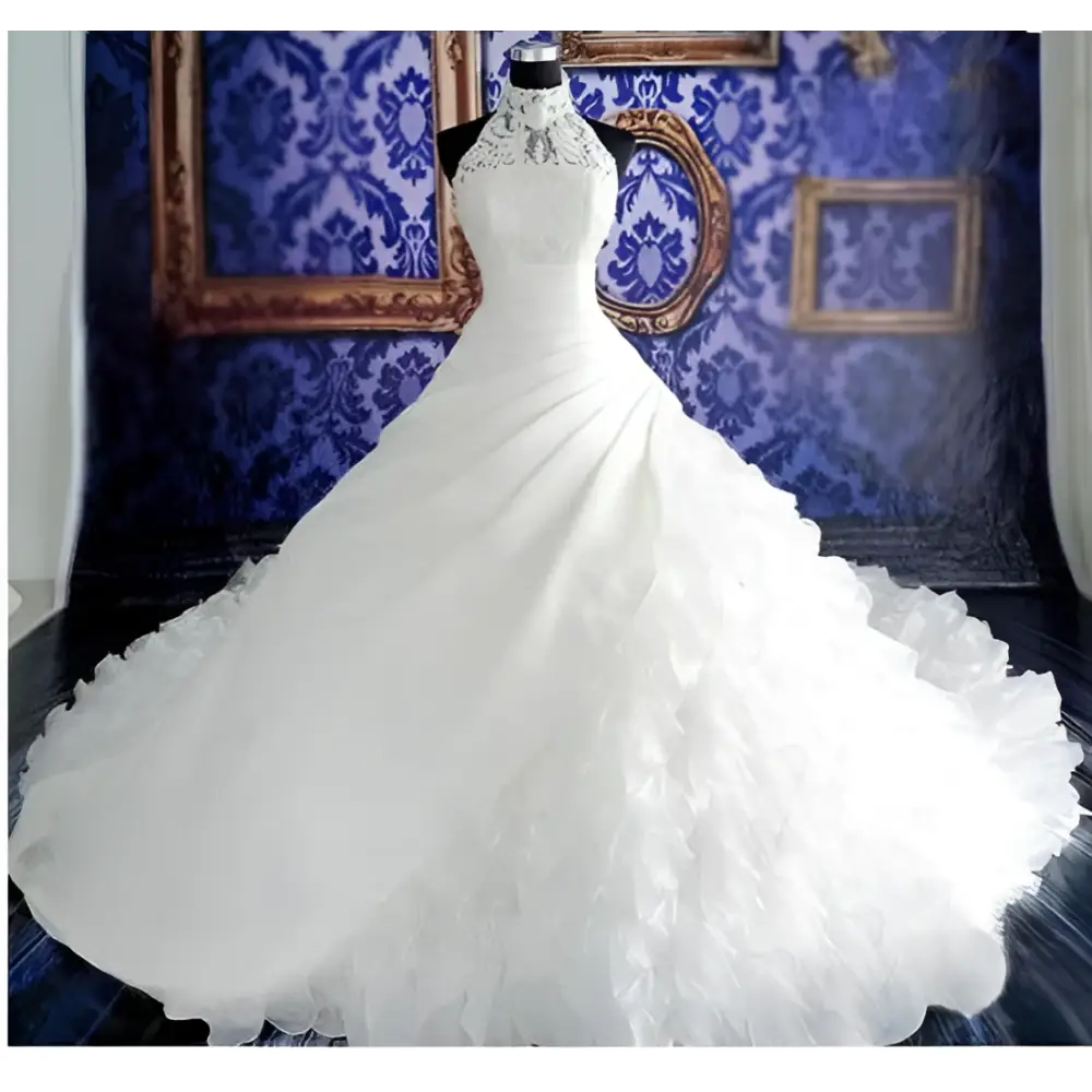 White floor-length wedding dress wholesale with fitted lace bodice and voluminous ruffled big tail skirt