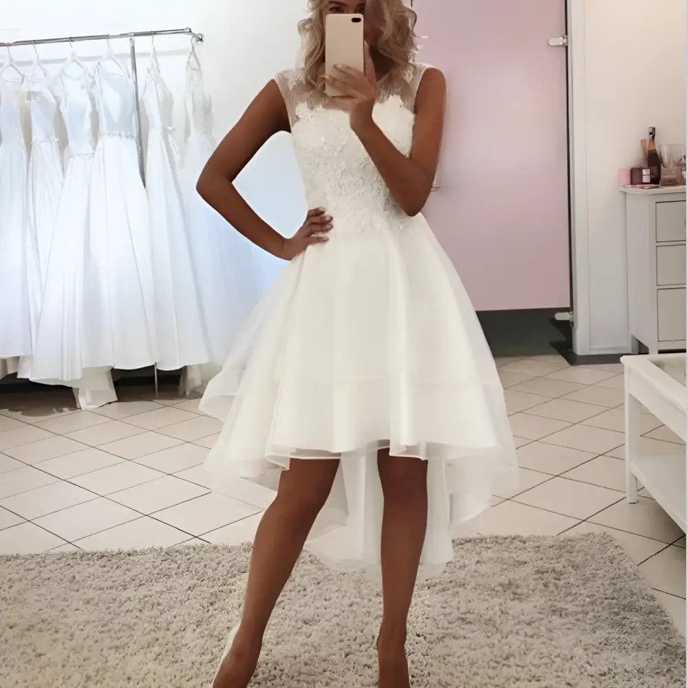 White lace and tulle short wedding dress with high low lace hemline style wedding dress design