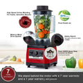 Red and black peak professional royale essence lux high-power commercial blender with clear food-grade jar filled with vegetables
