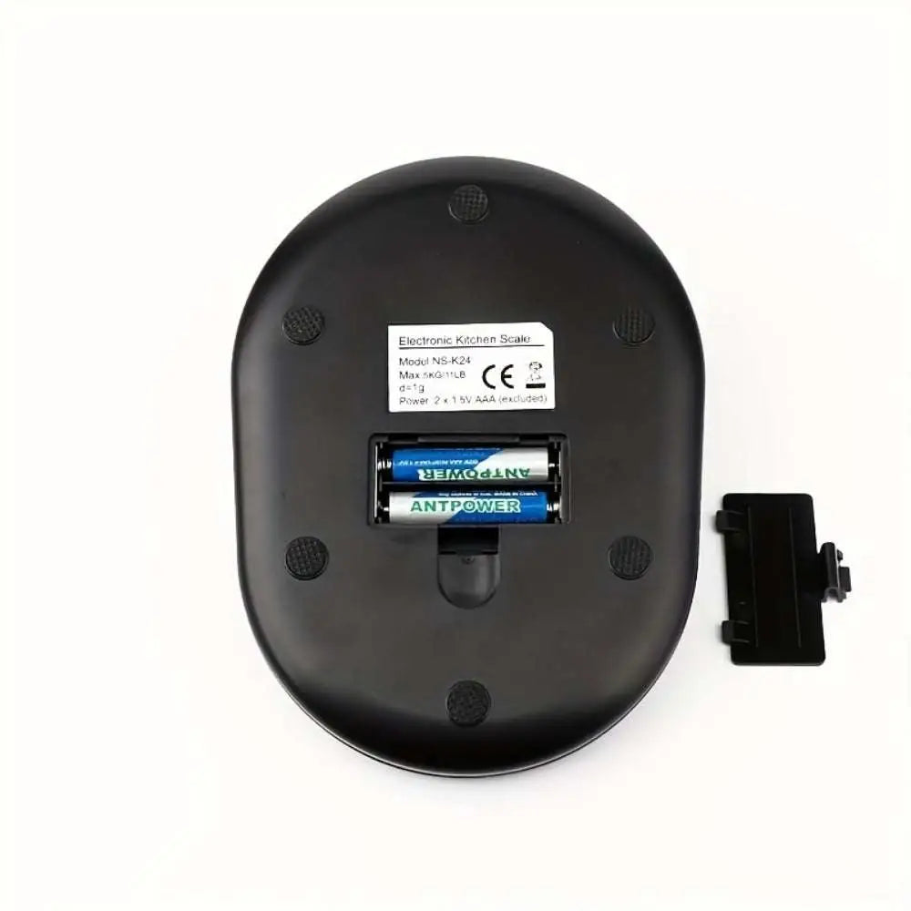 Black oval-shaped high precision household food electronic scale with matte finish, two AA batteries, and removable cover