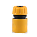 Yellow plastic garden hose connector with black rubber seal and ridged cap for brass high pressure power washer spray nozzle