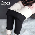 Black high stretch winter leggings with plush white fleece lining and rolled cuffs by royale essence lux