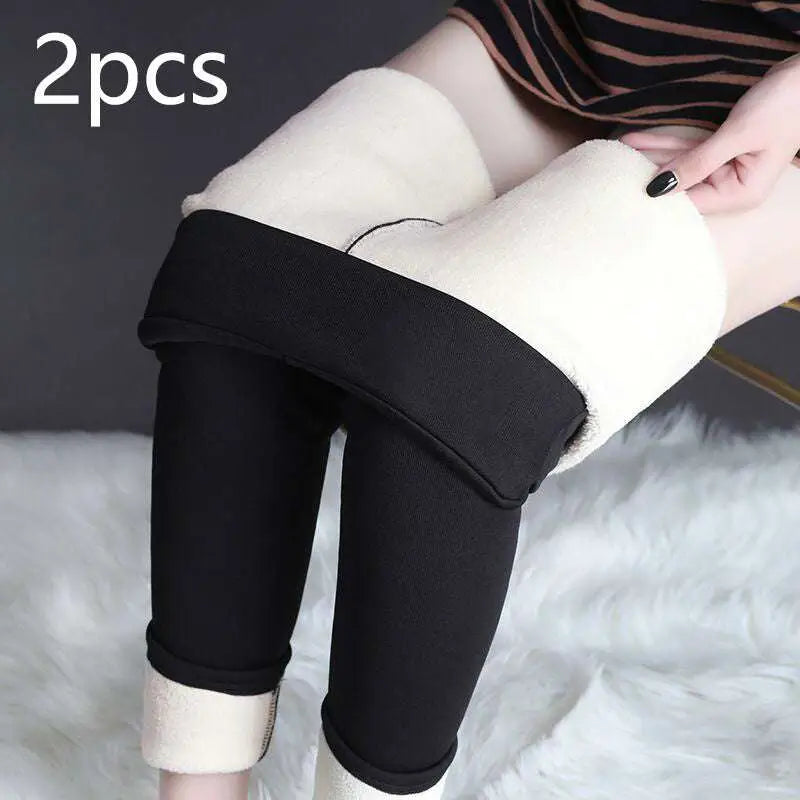 Black high stretch winter leggings with plush white fleece lining and rolled cuffs by royale essence lux