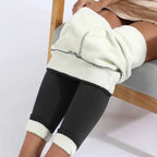 Black high stretch winter leggings with plush white fleece lining and ribbed cuffs by royale essence lux
