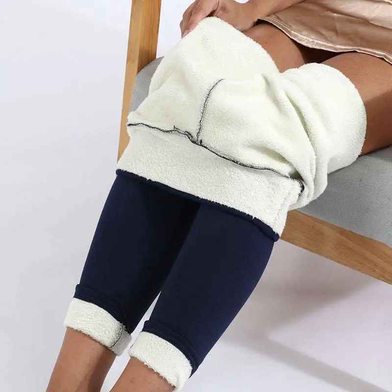 Cream-colored high stretch winter leggings with fleece lining and navy blue outer fabric with rolled cuffs by Royale Essence Lux