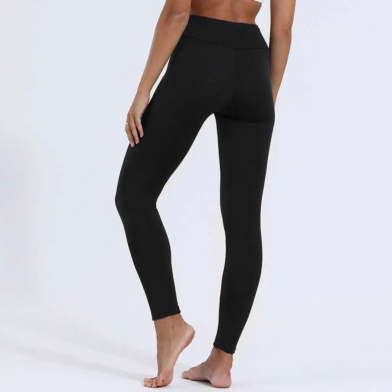 Black high-waisted winter leggings with fleece lining made of stretchy, form-fitting fabric by royale essence lux