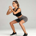 Black and gray high waist fitness two-piece set with sleek crop top and form-fitting athletic yoga pants shorts