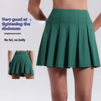A green pleated skirt with a heightened waistband designed for fitness yoga exercise and aerobics high waist activities