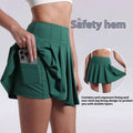 A vibrant green pleated skirt with safety hem and side pocket designed for fitness yoga exercise and aerobics high waist use