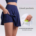 Navy blue pleated skirt with lined pockets for tennis ball or phone designed for fitness yoga exercise and aerobics high waist use