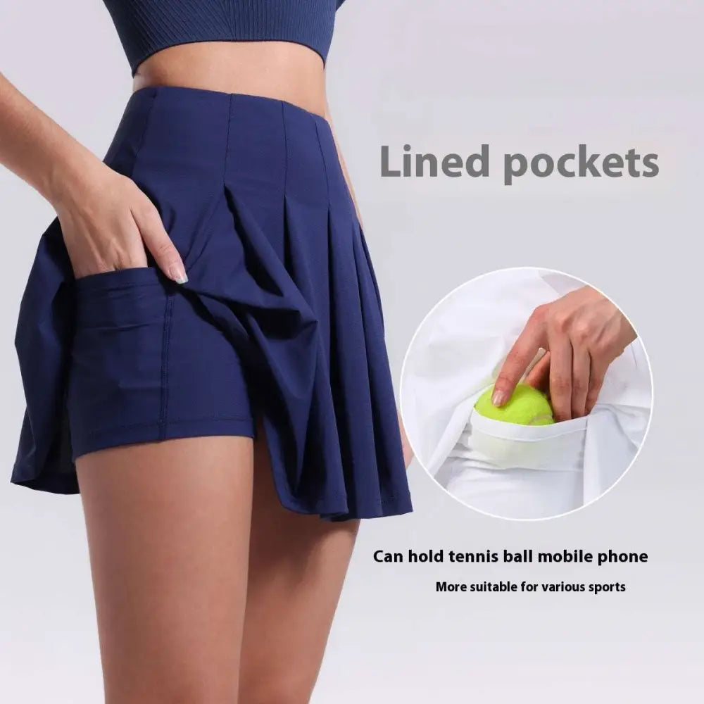 Navy blue pleated skirt with lined pockets for tennis ball or phone designed for fitness yoga exercise and aerobics high waist use