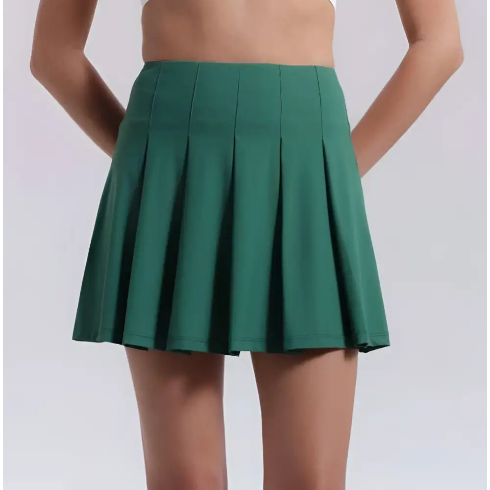 Emerald green pleated skirt with fitted waistband and flared hem for fitness yoga exercise and aerobics high waist use