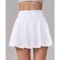 White pleated skirt with high waistband featuring crisp clean lines for fitness yoga exercise and aerobics high waist use