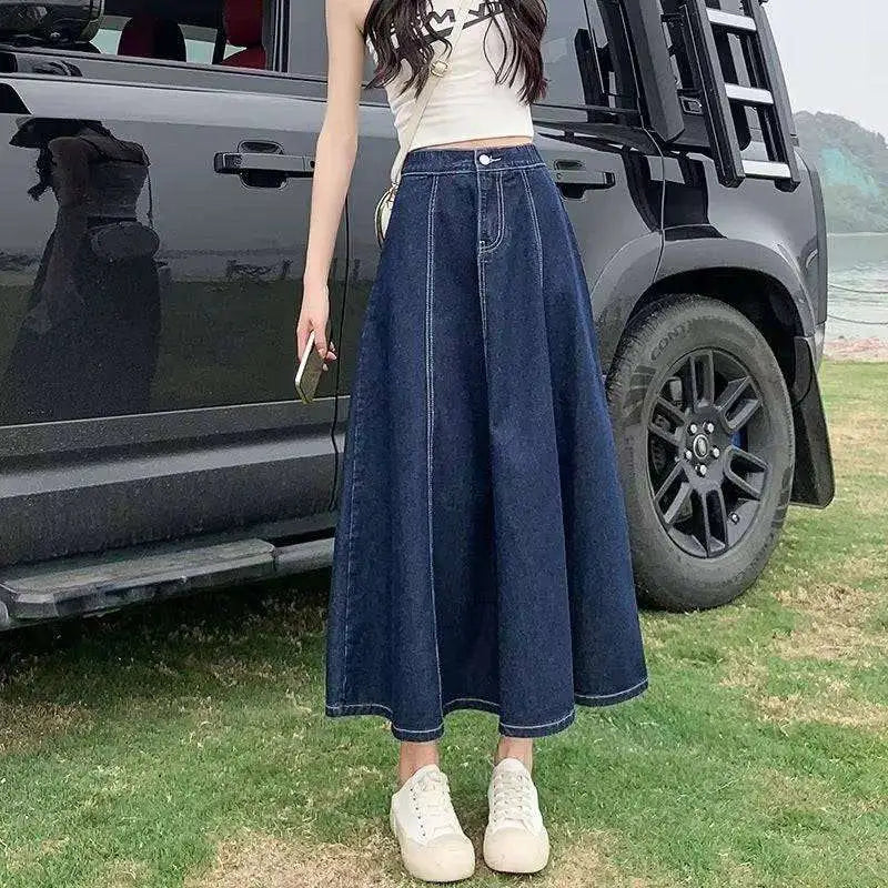 Dark blue denim skirt women’s mid-length with high waist flared silhouette made of durable denim fabric