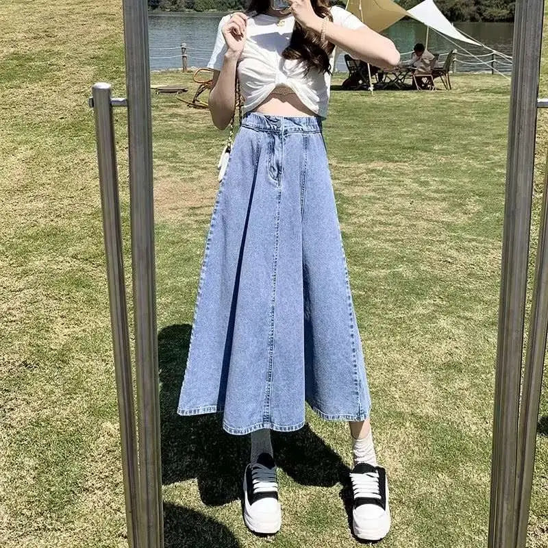 Light-wash denim skirt women’s mid-length high waist flared design in a wide-leg cut made from denim material
