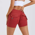 Red high waist hip lifting shorts with two buttoned cargo pockets on the back ideal for activewear