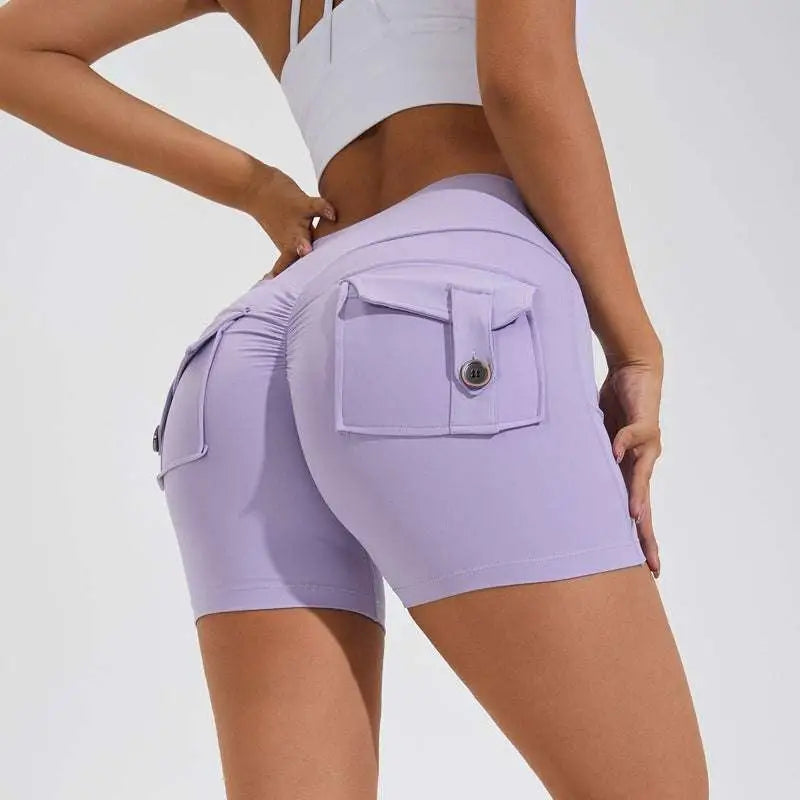 Lavender high waist hip lifting shorts shown from the back with ruched waistband and button-flap pocket