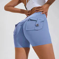 Light blue high waist hip lifting shorts made of stretchy fabric with a buttoned back pocket visible from the back side