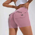 Pink high waist hip lifting shorts with textured fabric and a buttoned pocket on the back side