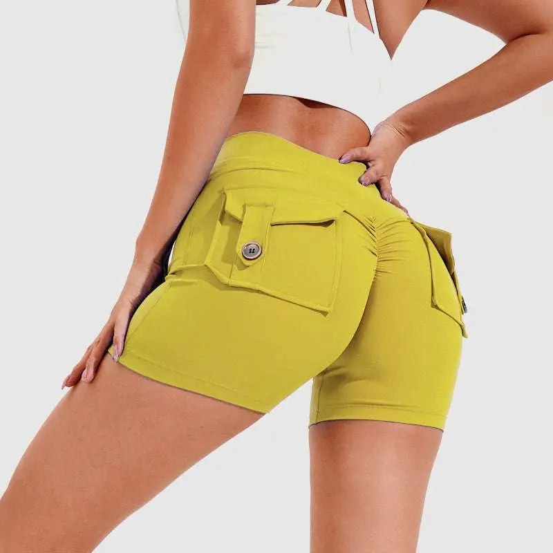 Bright yellow high waist hip lifting shorts with ruched back and button-flap pockets, back side view