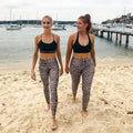 High waist leopard print leggings in black and beige with a snug form-fitting design for activewear or casual use