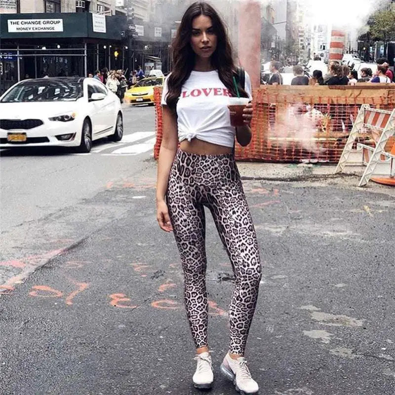 White cropped t-shirt with red lover text and knotted front paired with high waist leopard print leggings