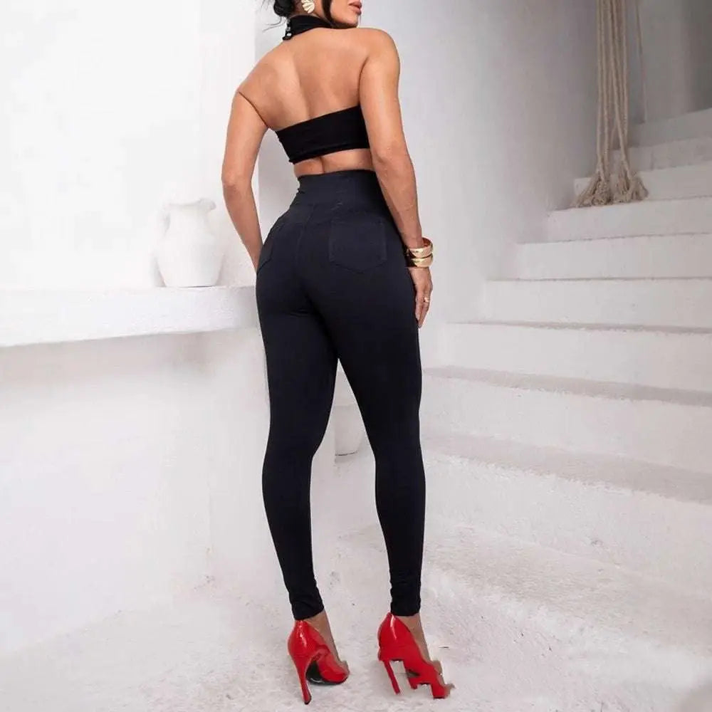 Black high waist metallic belt skinny pants shown from back with snug fit and functional back pocket detail