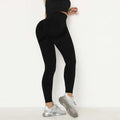 Black high waist peach hip yoga pants showing padded back design for enhanced shaping and support