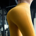 A high waist pink yellow yoga set featuring vibrant mustard-yellow leggings with subtle seams in a cotton blend fabric