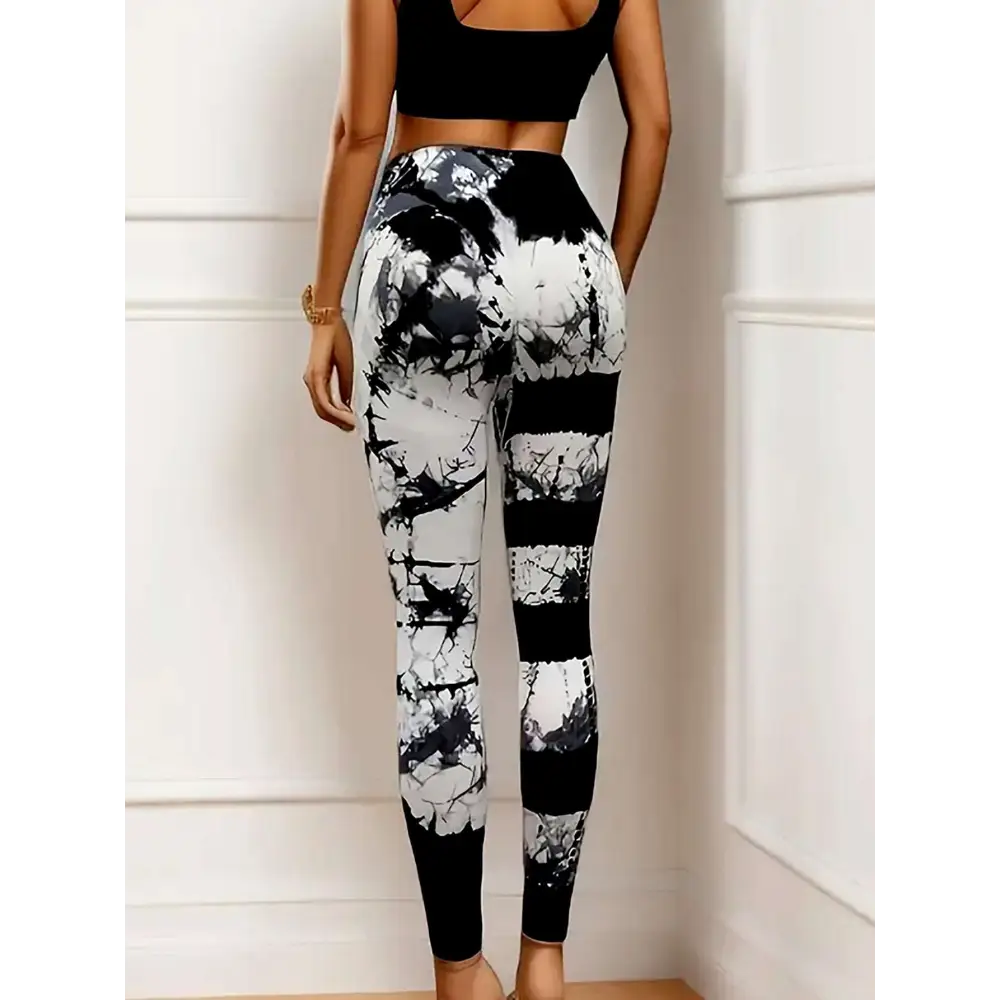 High waist tie dye yoga pants with black and white vertical stripes and butt lift design in high stretch fabric