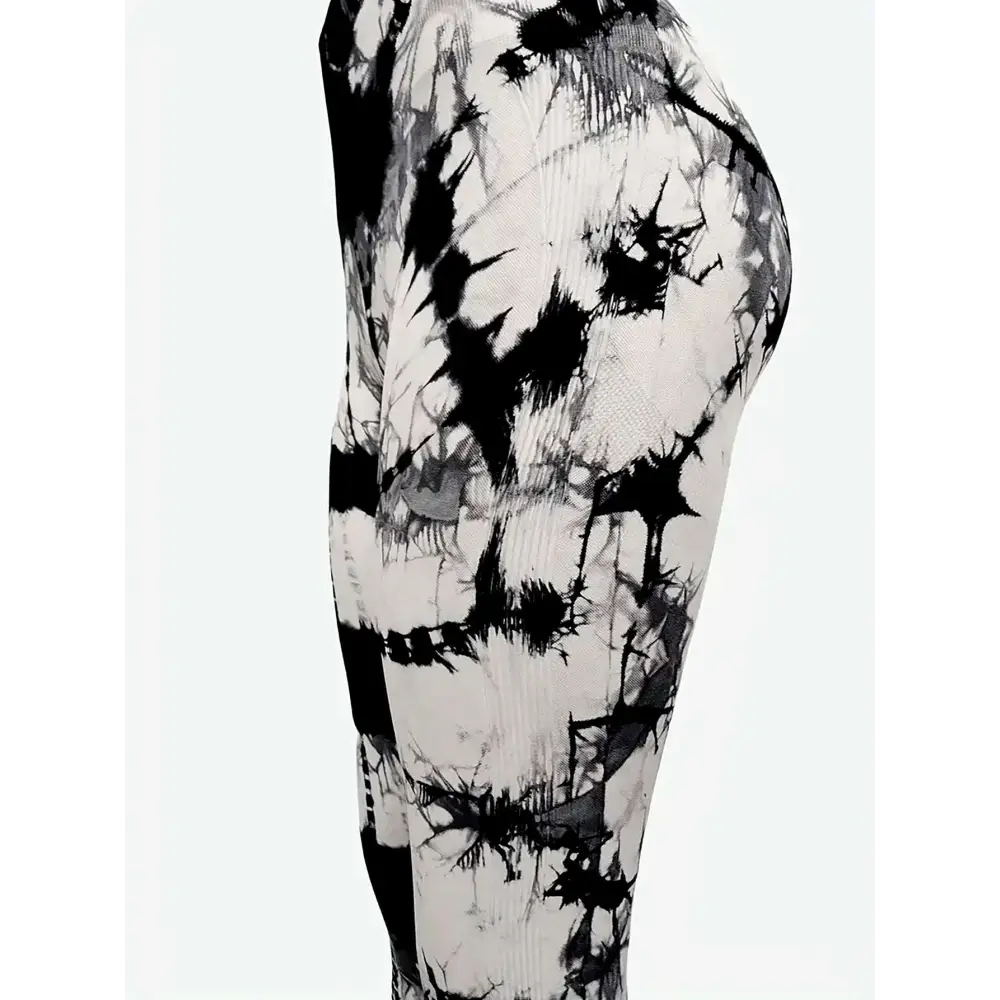 High waist tie dye yoga pants in black and white ribbed fabric designed for a comfortable butt lift fit