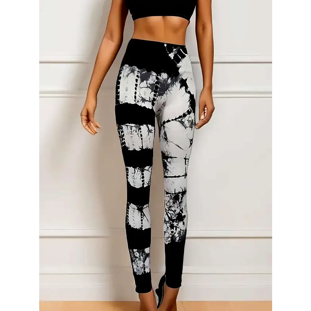High waist tie dye yoga pants in black and white with a sleek butt lift design and form fitting high waist fit