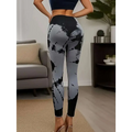 Black and gray tie dye yoga pants with high waist tie and butt lift design in a snug, form-fitting style