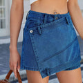 Blue high waist washed irregular denim short skirt featuring a diagonal flap pocket and silver button closures