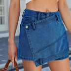 Blue high waist washed irregular denim short skirt featuring a diagonal flap pocket and silver button closures