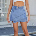 Blue high waist washed irregular denim short skirt with light-wash mini design and diagonal flap button closure