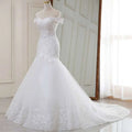 High waist white lace mermaid wedding dress featuring an off-the-shoulder design with intricate lace and tulle skirt