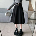 Black high waist woolen umbrella skirt with matching belt and front pockets in a-line design
