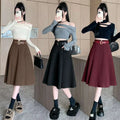 Three models showcase woolen umbrella skirt midi style in brown high waist black and burgundy with matching belt
